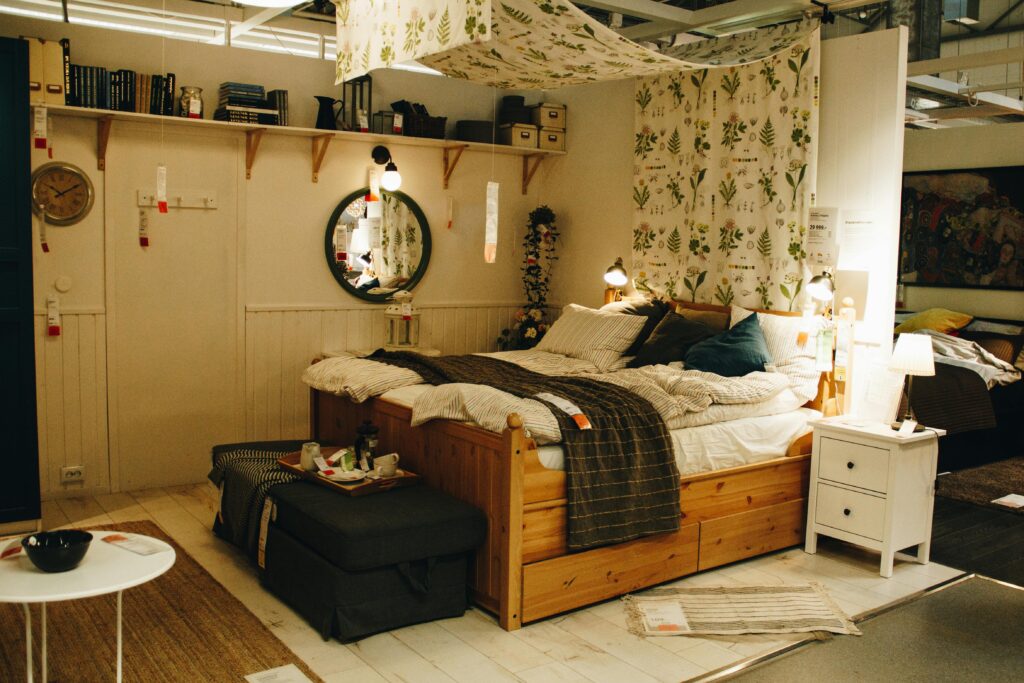 Explore a cozy and modern bedroom setup featuring wooden furniture, decorative rugs, and stylish lighting.